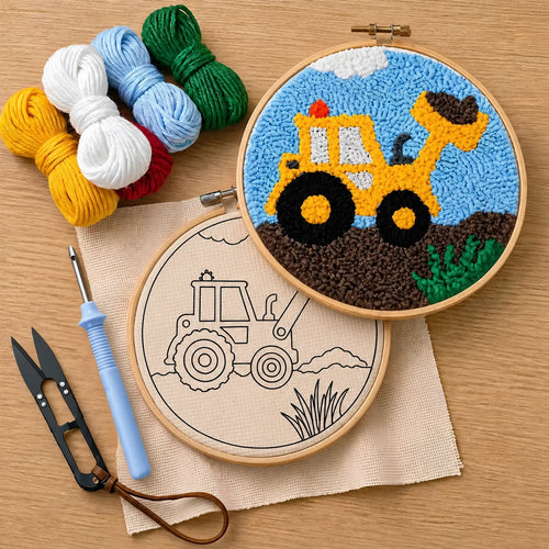 Embroidery hoops with construction-themed designs with a punch needled buldozer, punch needle, thread cutter and yarns on a wooden surface