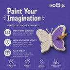 Promotional graphic for a HOBBIX kids' painting kit on a purple background. The design features a partially painted concrete butterfly with purple and white wings, a paintbrush, and text highlighting key selling points like step-by-step guidance, screen-free activity, and all-in-one kit contents. Encourages screen-free play, improves focus, boosts creativity, parent- child bonding.