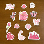 Collection of pink and white cute aesthetic stitch and stitch stickers on a wooden surface