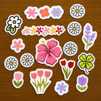 Flower-themed streetwear stitch and stitch stickers on a textured surface
