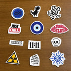 Collection of streetwear fashion stitch and stitch stickers  on a wooden surface