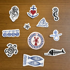 Ocean-themed streetwear stitch and stitch stickers  on a wooden surface